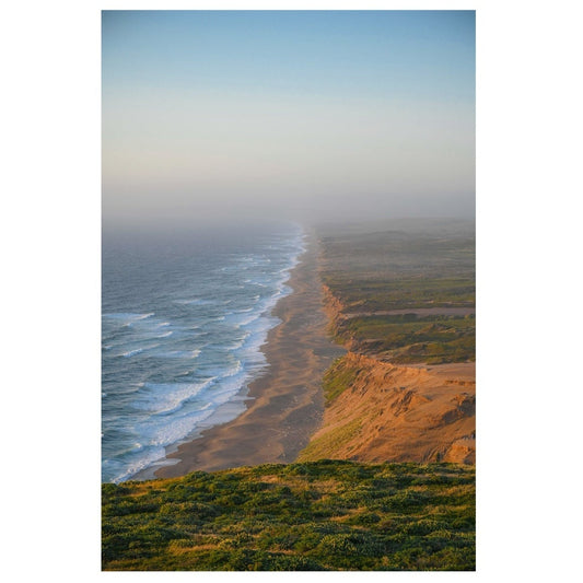 Scenic view of a coastal landscape with ocean and cliffs.